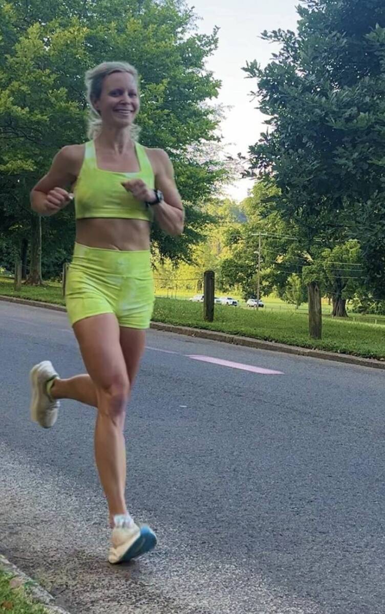 Whitney Heins running in green